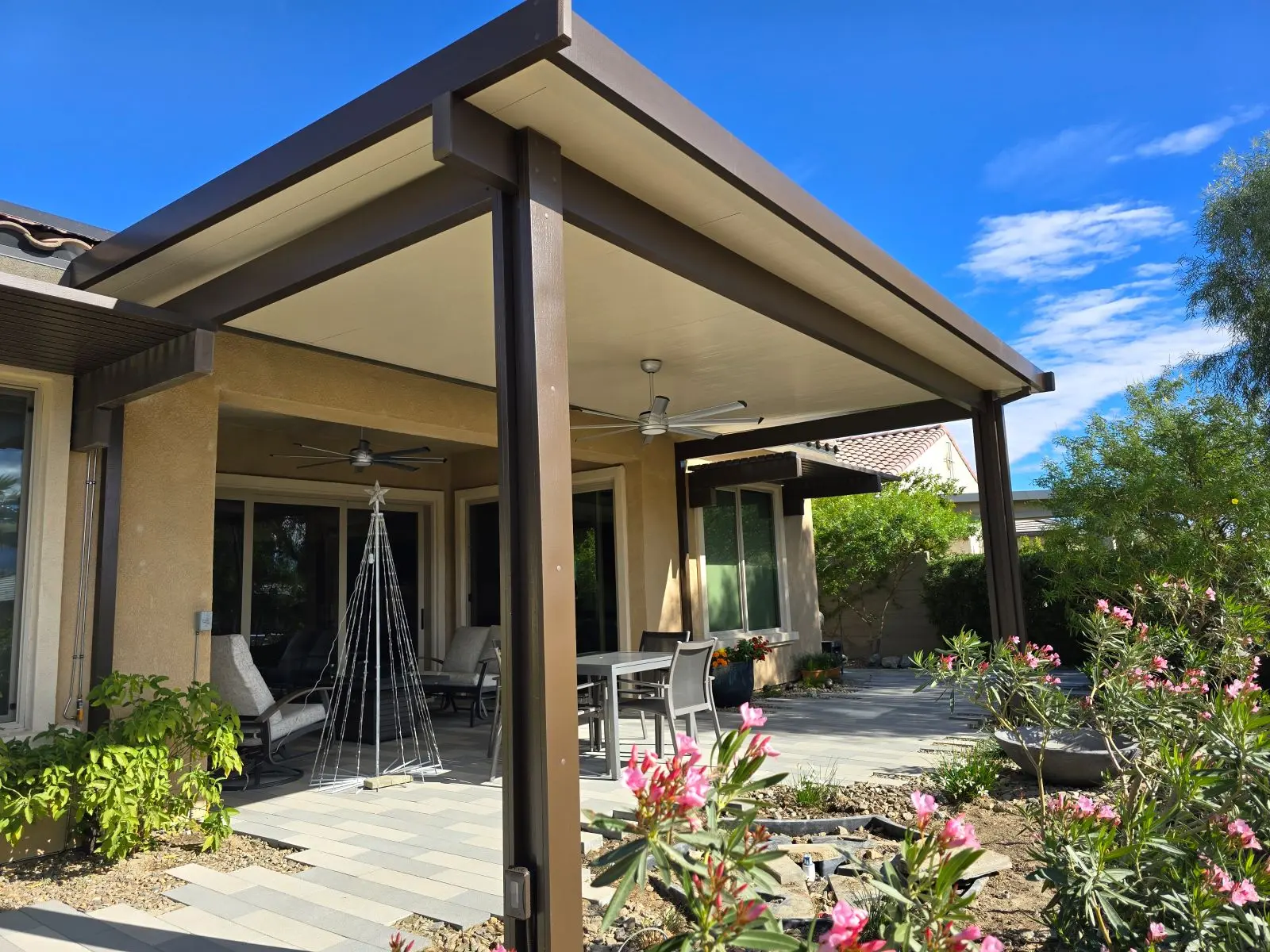 Duralum attached insulated patio cover in Siennawood and Sandalwood on a DFW home