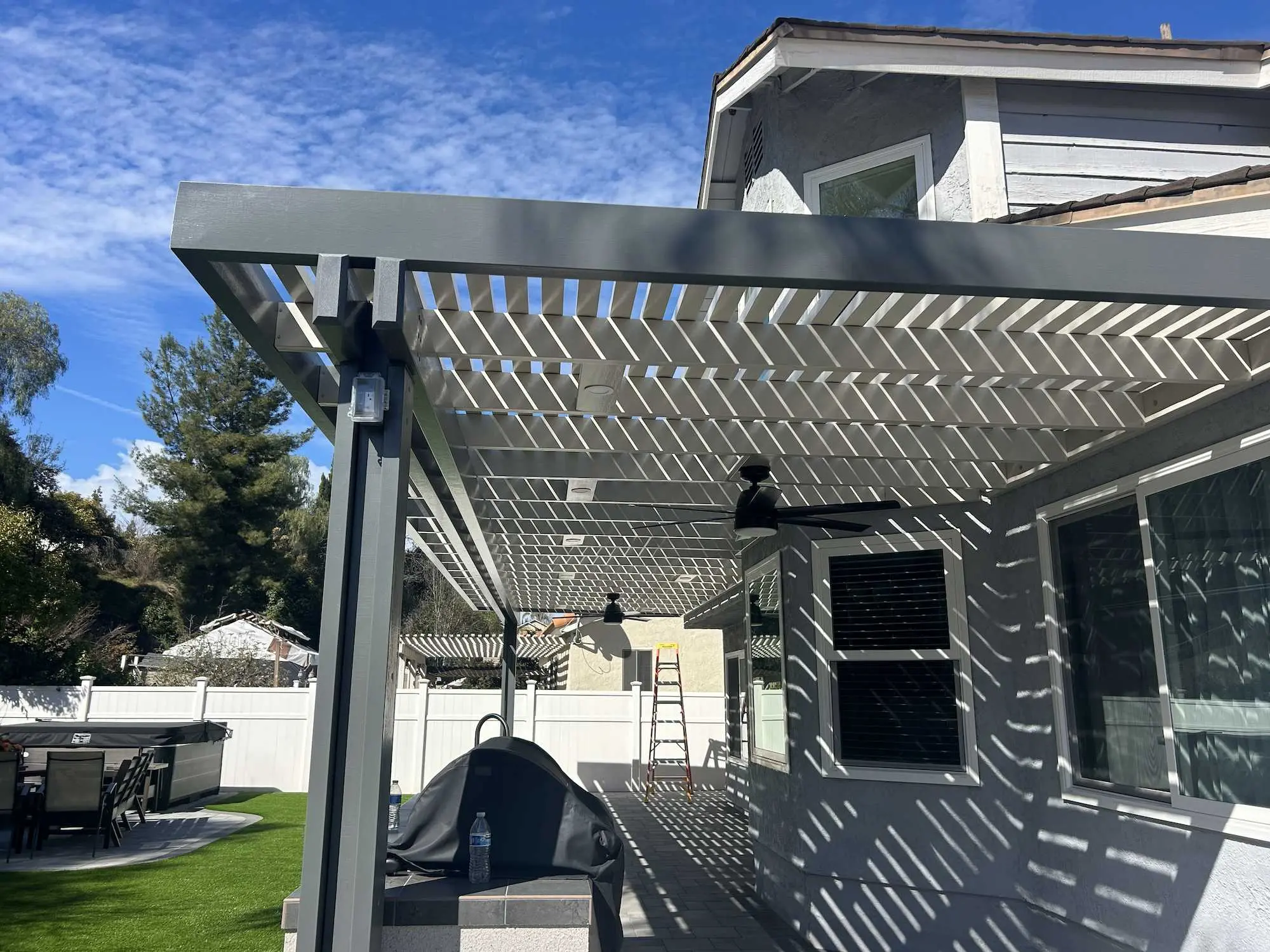 Duralum attached pergola with slate frame and white lattice