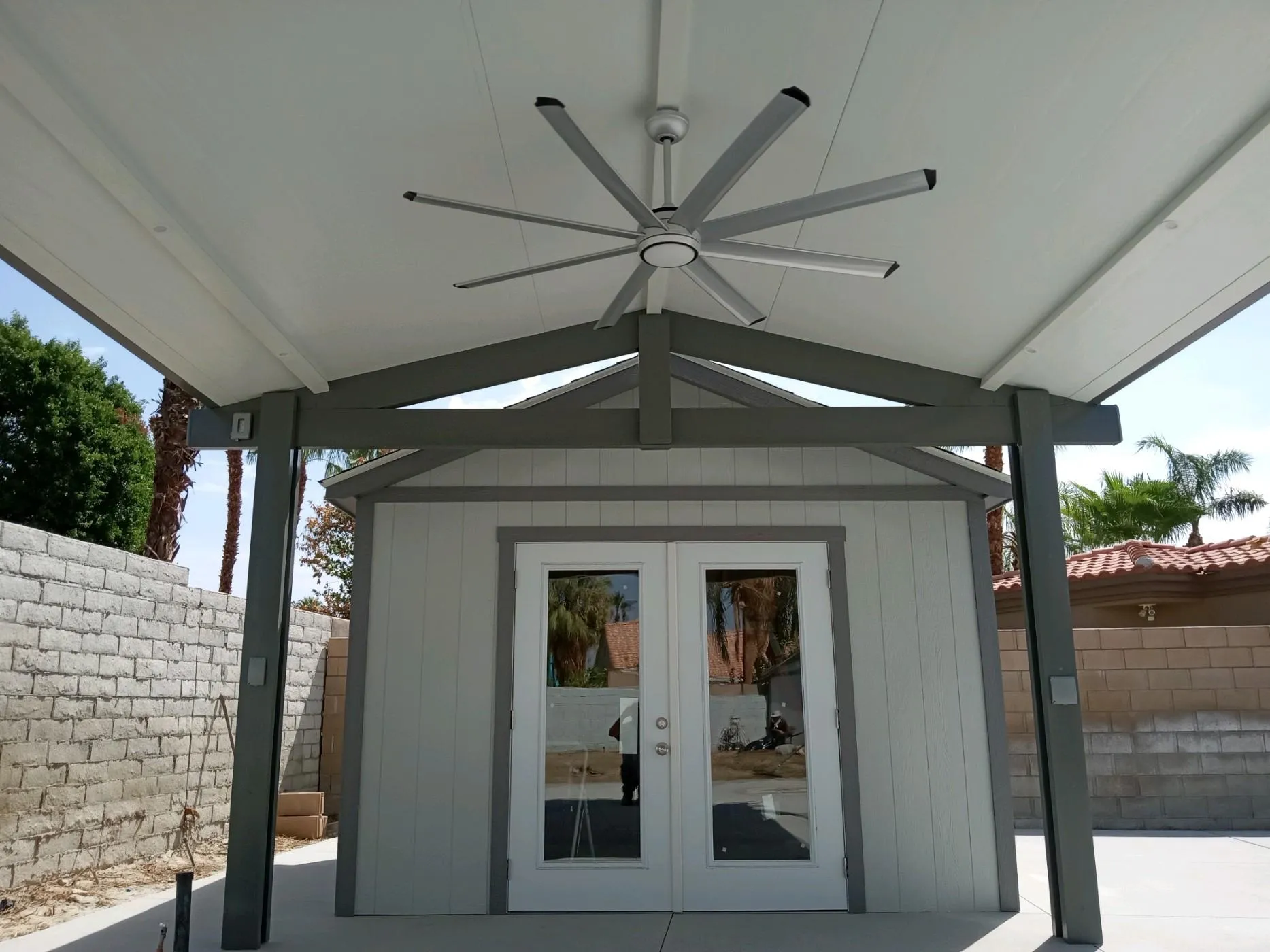 Weatherwood freestanding insulated gable roof for a covered outdoor area