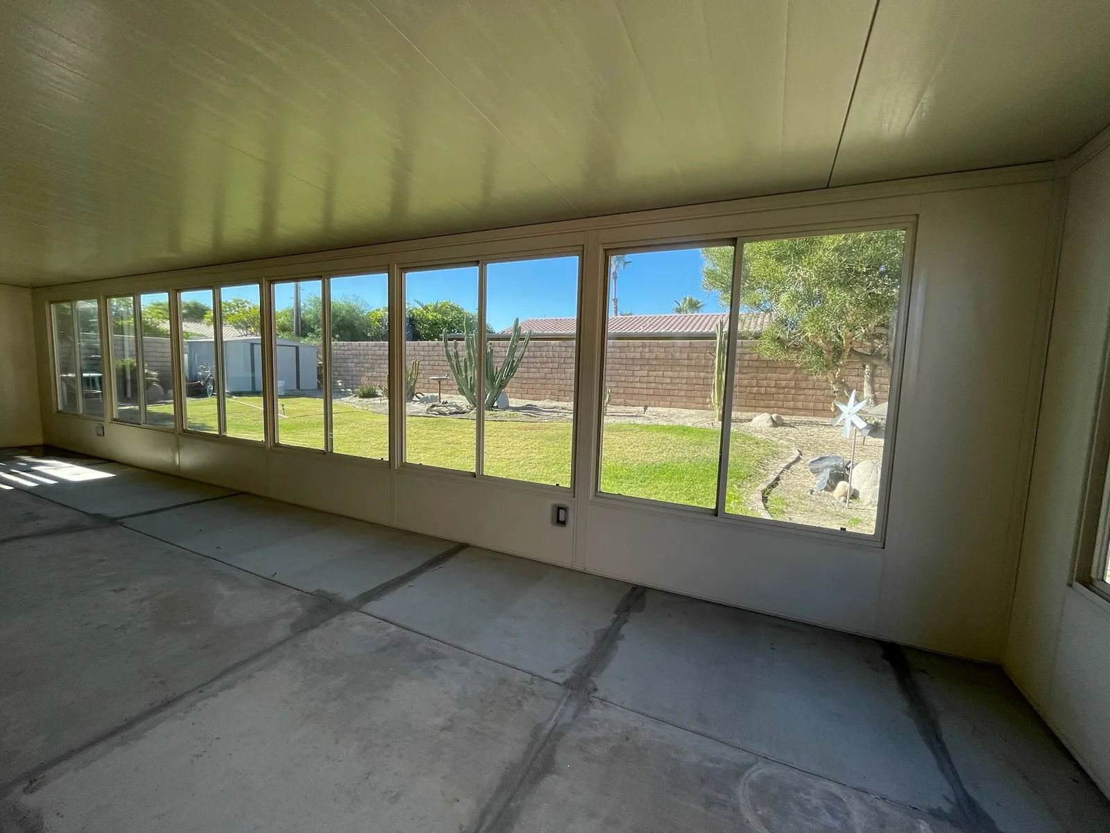 Duralife room enclosure interior view looking out through glass panels